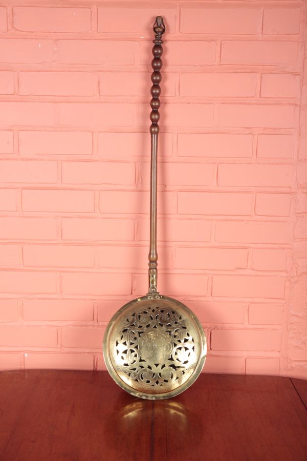 A PIERCED BRASS WARMING PAN