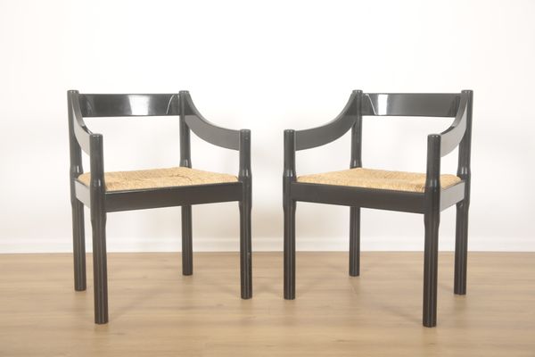 VICO MAGISTRETTI (1920-2006) FOR HABITAT: A PAIR OF BLACK LACQUERED ‘CARIMATE’ ARMCHAIRS