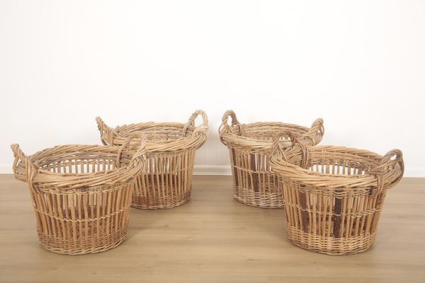 A GROUP OF FOUR WICKER QUARTER CRAN HERRING BASKETS