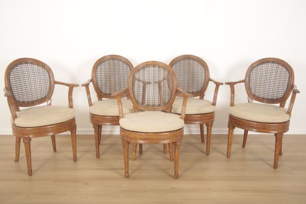 A SET OF FIVE FRENCH CANED AND GRAINED BEECHWOOD ARMCHAIRS