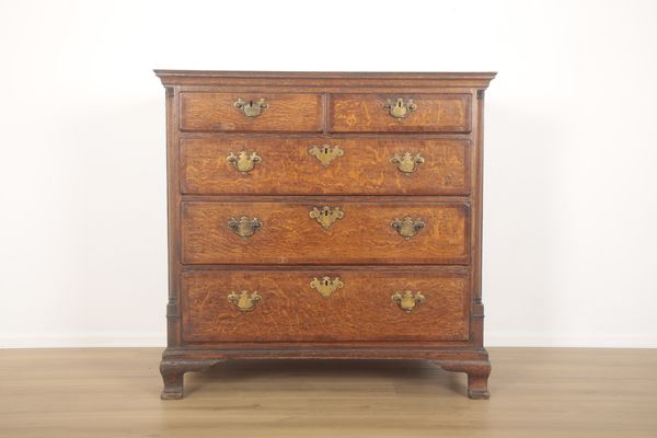 A GEORGE III OAK CHEST OF DRAWERS