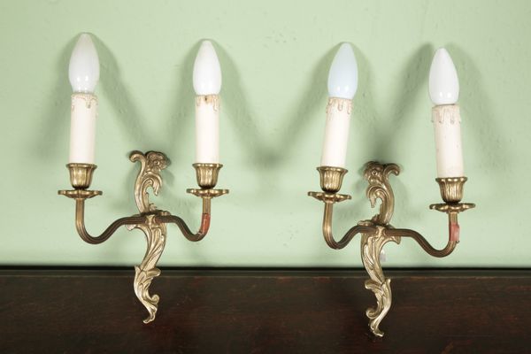 A PAIR OF GILT METAL TWO BRANCH WALL LIGHTS