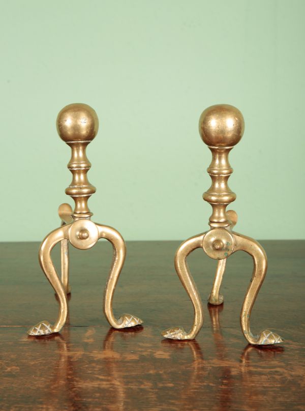 A PAIR OF BRASS ANDIRONS