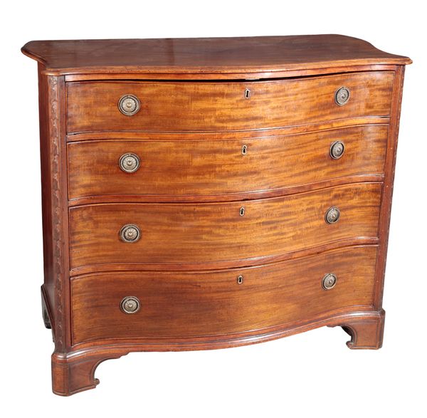 A GEORGE III MAHOGANY SERPENTINE CHEST OF DRAWERS