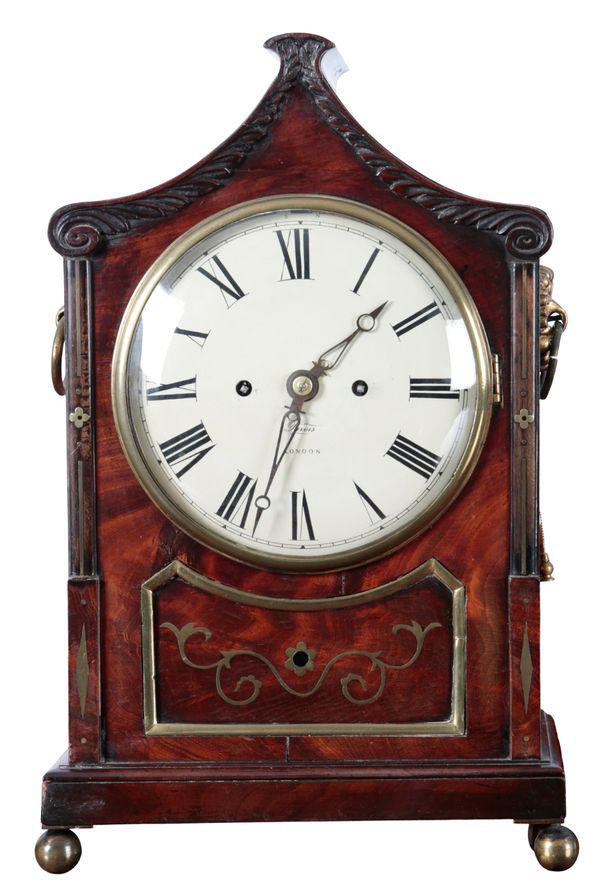 A REGENCY MAHOGANY AND BRASS INLAID BRACKET CLOCK BY PURVIS OF LONDON