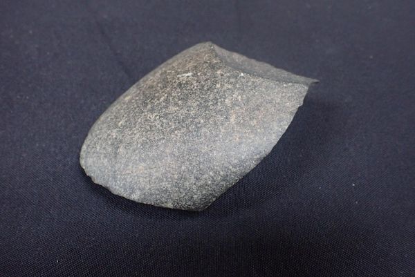 A WORKED STONE HAND AXE