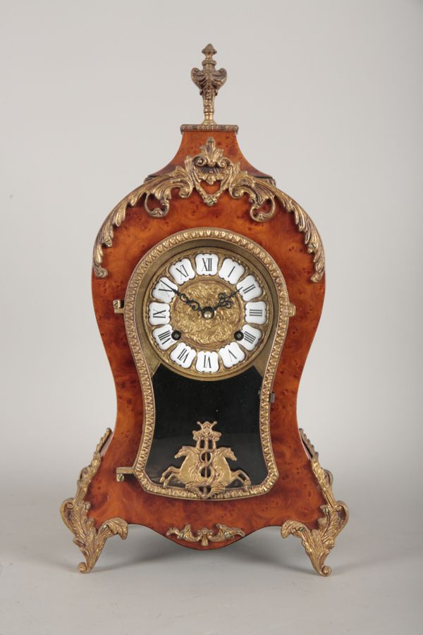 A HERMLE WEST GERMAN FIGURED WALNUT MANTEL CLOCK