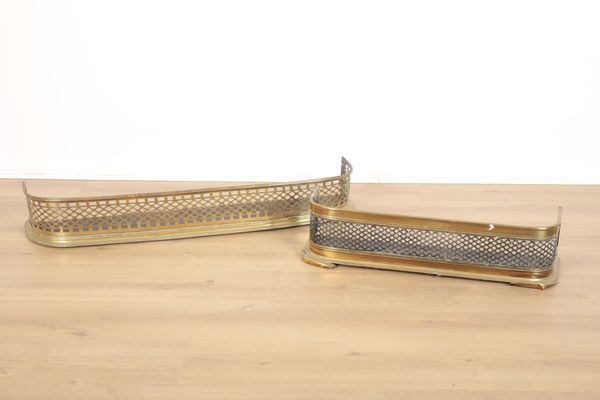 A VICTORIAN BRASS AND IRON PIERCED GRILLE CURVED FIRE FENDER