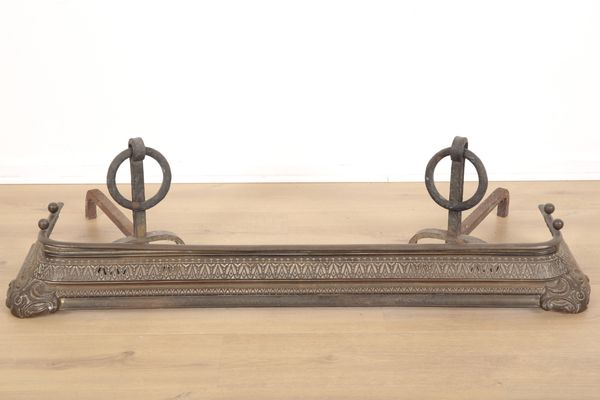 A VICTORIAN IRON PIERCED GRILLE CURVED FIRE FENDER