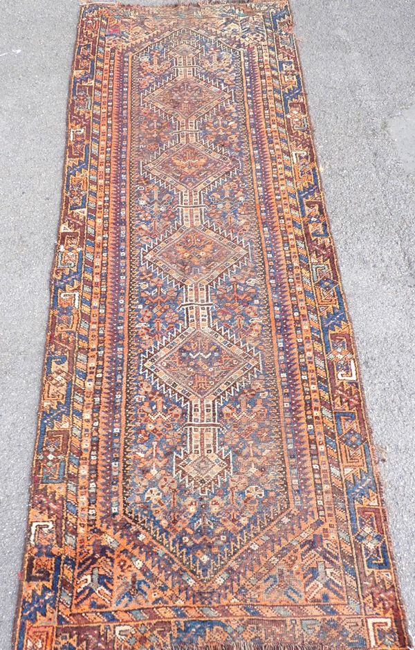 AN ANTIQUE SHIRVAN LONG RUG