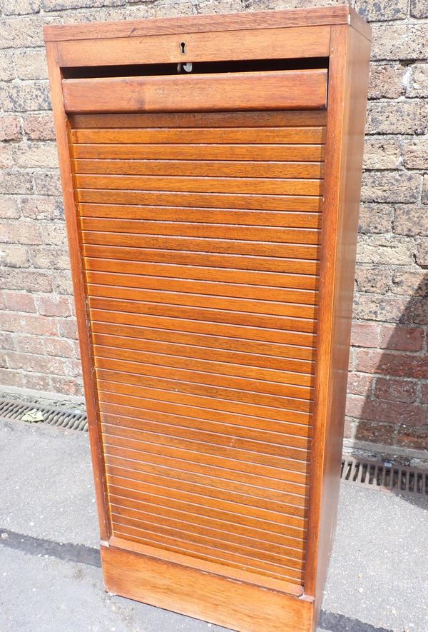 AN OAK TAMBOUR-FRONT FILING CABINET