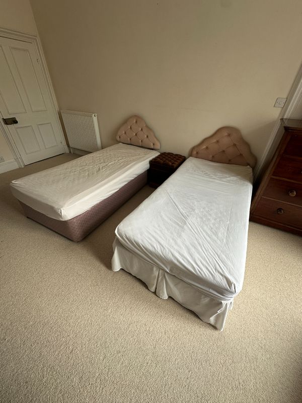 A PAIR OF SINGLE BEDS