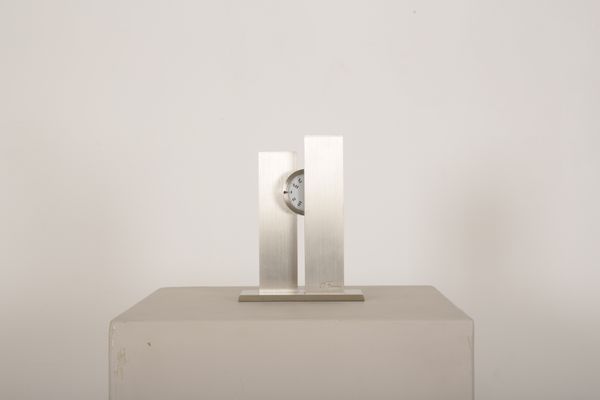 A 1970'S BRUSHED STEEL MODERNIST CLOCK BY MICHEL FLEURY