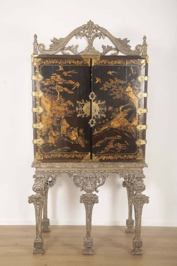 A BLACK LACQUER AND CHINOISERIE DECORATED CABINET ON STAND IN WILLIAM AND MARY STYLE