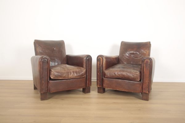 A PAIR OF LEATHER CLUB ARMCHAIRS