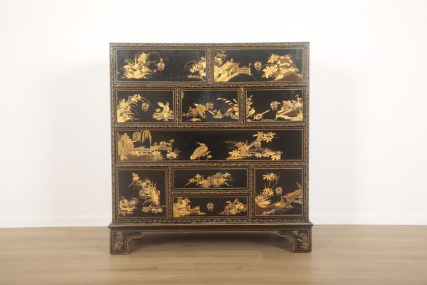 A BLACK LACQUER AND PARCEL-GILT CHINOISERIE DECORATED CHEST OF DRAWERS