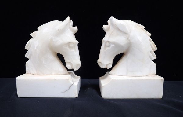 A PAIR OF ALABASTER HORSE'S HEAD BOOKENDS