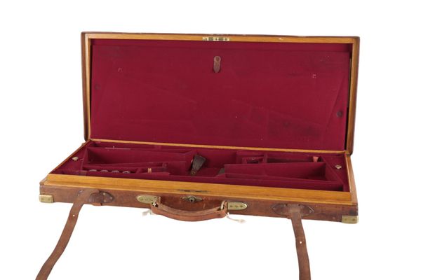 HOLLAND & HOLLAND: A DOUBLE LEATHER AND OAK GUN CASE