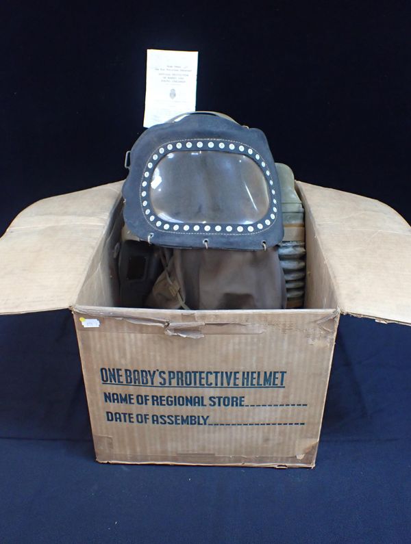 A WWII BABY'S PROTECTIVE HELMET (GAS MASK)