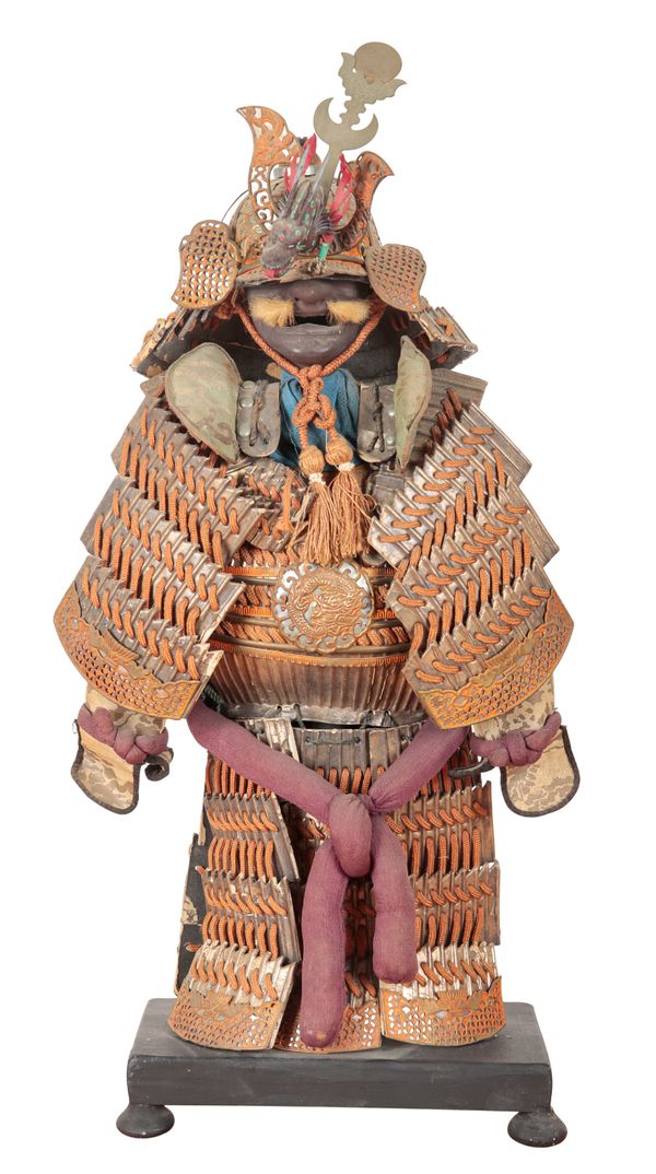 A SILVERED CARD AND ORANGE CLOTH MINIATURE SAMURAI UNIFORM