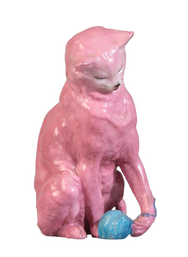 A MEISSEN PINK GLAZED PORCELAIN FIGURE OF CAT