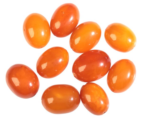 TEN DRILLED AMBER BEADS