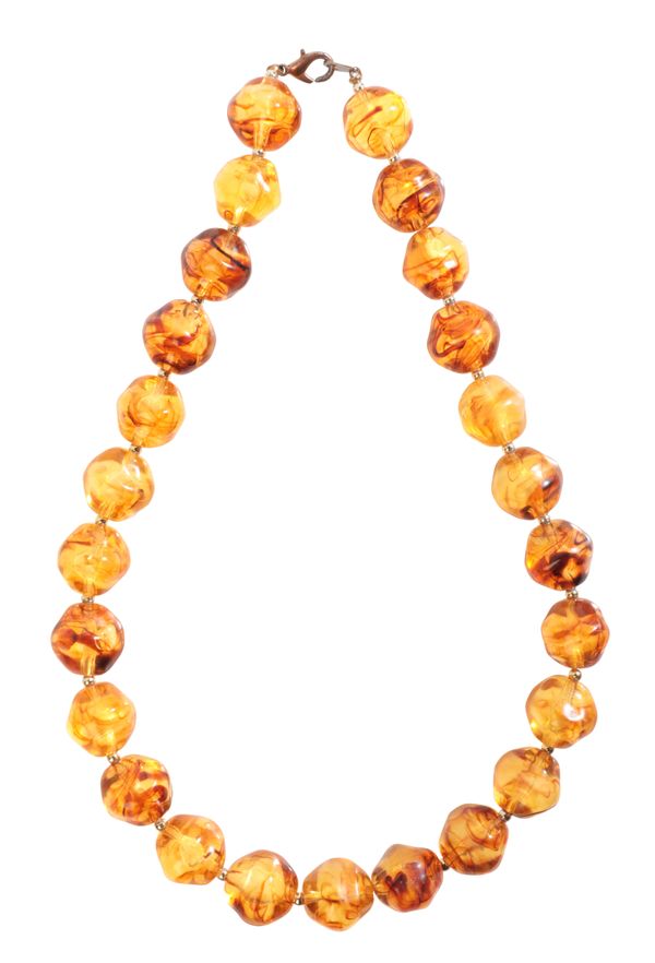 AN ORANGE BEAD NECKLACE