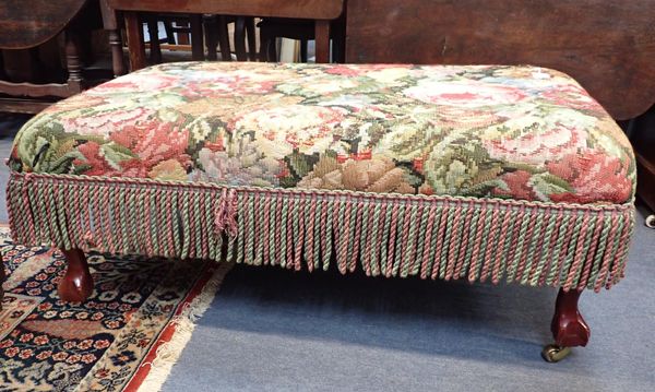 AN UPHOLSTERED COUNTRY HOUSE STYLE FOOTSTOOL