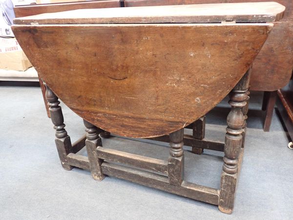 A CHARLES II OAK GATELEG TABLE