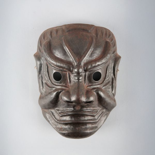 A JAPANESE IRON NOH MASK OR SOMEN