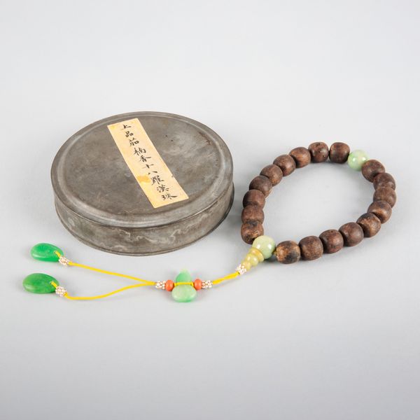 A CHINESE TURNED WOOD AND JADE ROSARY