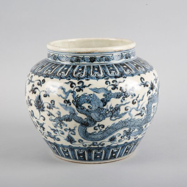 A CHINESE PORCELAIN BLUE AND WHITE 'DRAGON' GUAN JAR