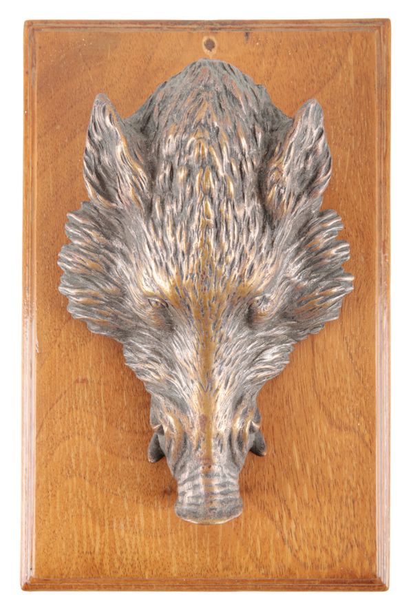AN EDWARDIAN BRONZE PAPERCLIP IN THE FORM OF A WILD BOAR HEAD
