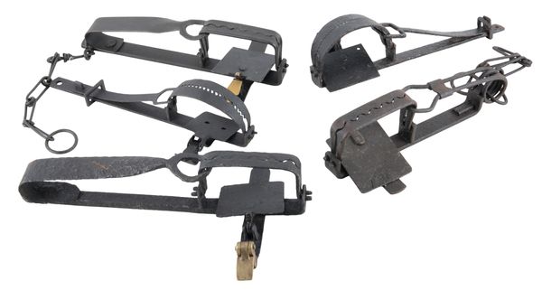 FIVE VARIOUS WROUGHT IRON GIN TRAPS