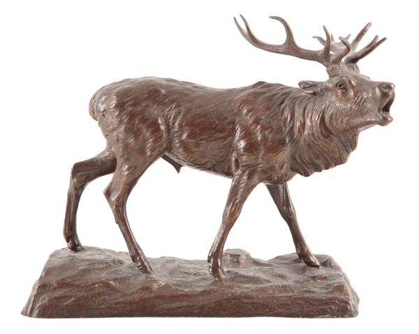 A BRONZE EFFECT FIGURE OF A STAG ROARING