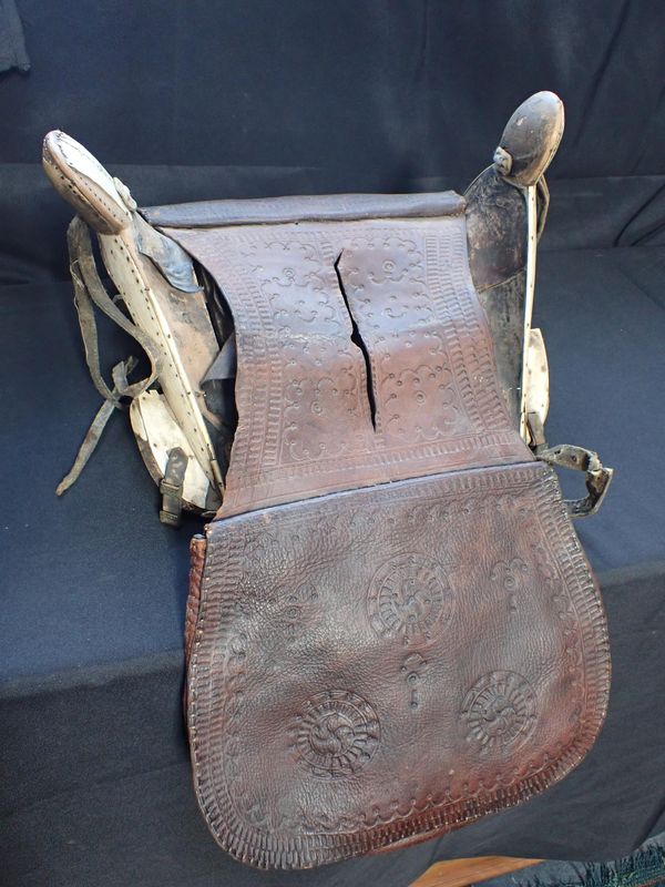 AN ANTIQUE SADDLE, WITH BONE VENEER