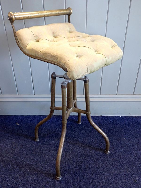 A VICTORIAN BRASS-FRAMED PIANO STOOL