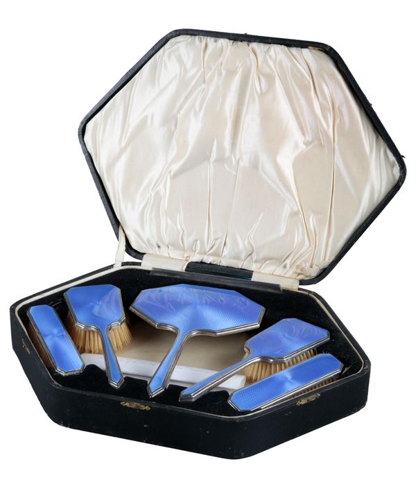 A GEORGE V BLUE GUILLOCHE ENAMELLED SILVER DRESSING TABLE SET