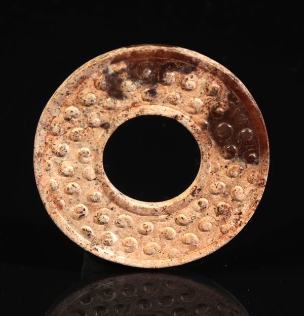 A CHINESE JADE 'GRAIN PATTERN' DISC