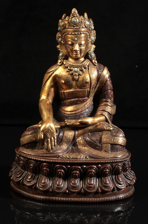 A GILT BRONZE FIGURE OF SEATED BUDDHA