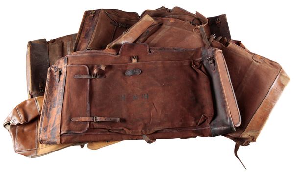 SIX ASSORTED LEATHER AND CANVAS GUN CASE COVERS