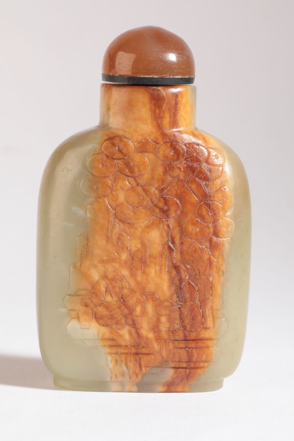 A CHINESE JADE 'MASTER OF THE ROCK' SNUFF BOTTLE