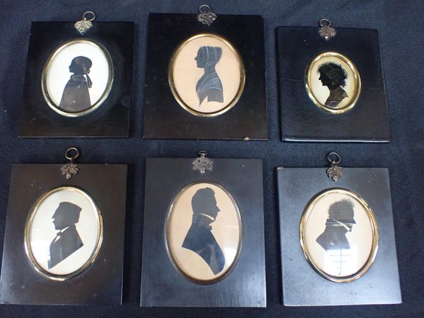 A GROUP OF SIX OVAL SILHOUETTES ON PAPER