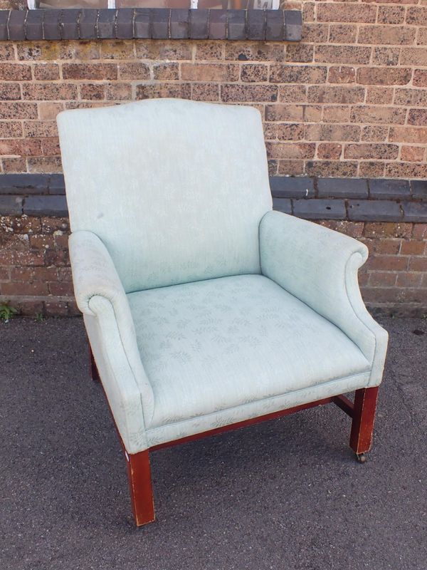 AN GEORGE III STYLE UPHOLSTERED ARMCHAIR