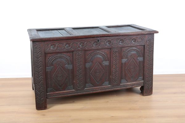 AN 18TH CENTURY CARVED OAK COFFER