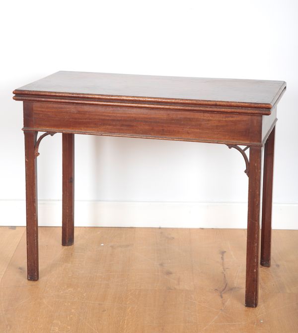 A MAHOGANY FOLD OVER CARD TABLE