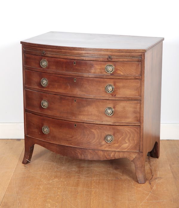 A MAHOGANY SERPENTINE SMALL CHEST OF DRAWERS