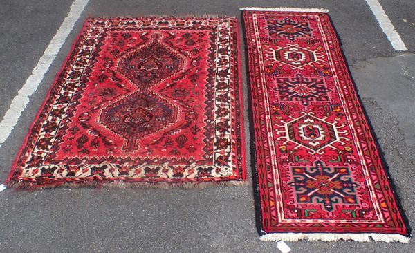 A  RED GROUND HAMEDAN RUNNER