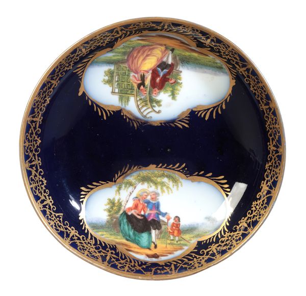 A CONTINENTAL PORCELAIN SAUCER