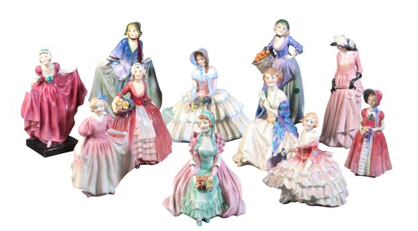 A COLLECTION OF EARLY ROYAL DOULTON POTTERY FIGURES